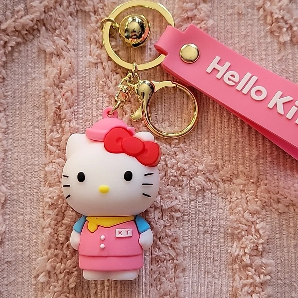 Hello Kitty, silicon keychain. NWOT. Metal hooks, pink and white 💗.